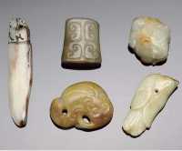 Ming Dynasty and later Five small celadon and russet jade carvings
